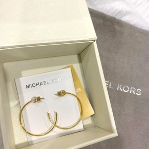 Brand new Michael Kors gold hoops.